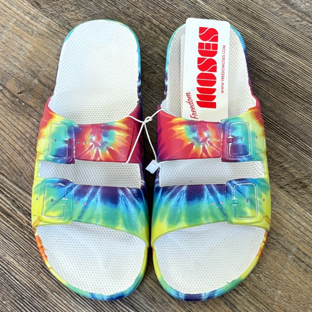NWT- Freedom Moses slides, woman’s size 8-9, color/pattern is Hendrix/tie-dye